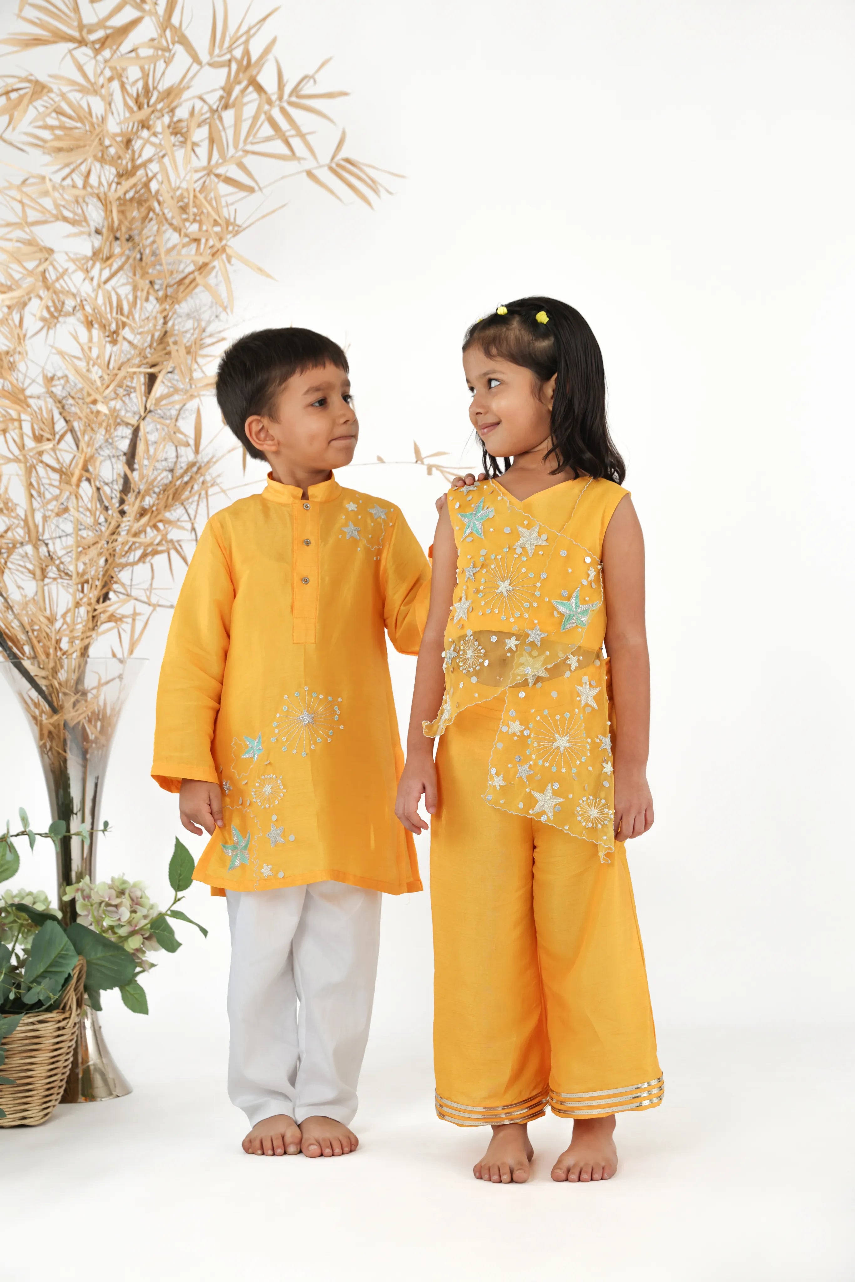 Twinning in Kesar Silk Top Silk Palazzo with Starry Embroidered Kurta and White Pyjama